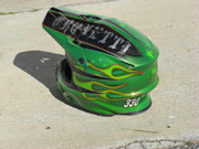 Green dirtbike helmet with stars and old school flames