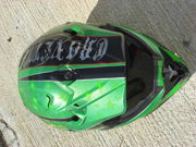 Green dirtbike helmet with stars and old school flames