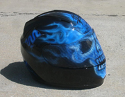 True fire blue skull full face motorcycle helmet with spine and brain exposed as well as airbushed visor.