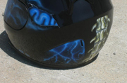 True fire blue skull full face motorcycle helmet with spine and brain exposed as well as airbushed visor.